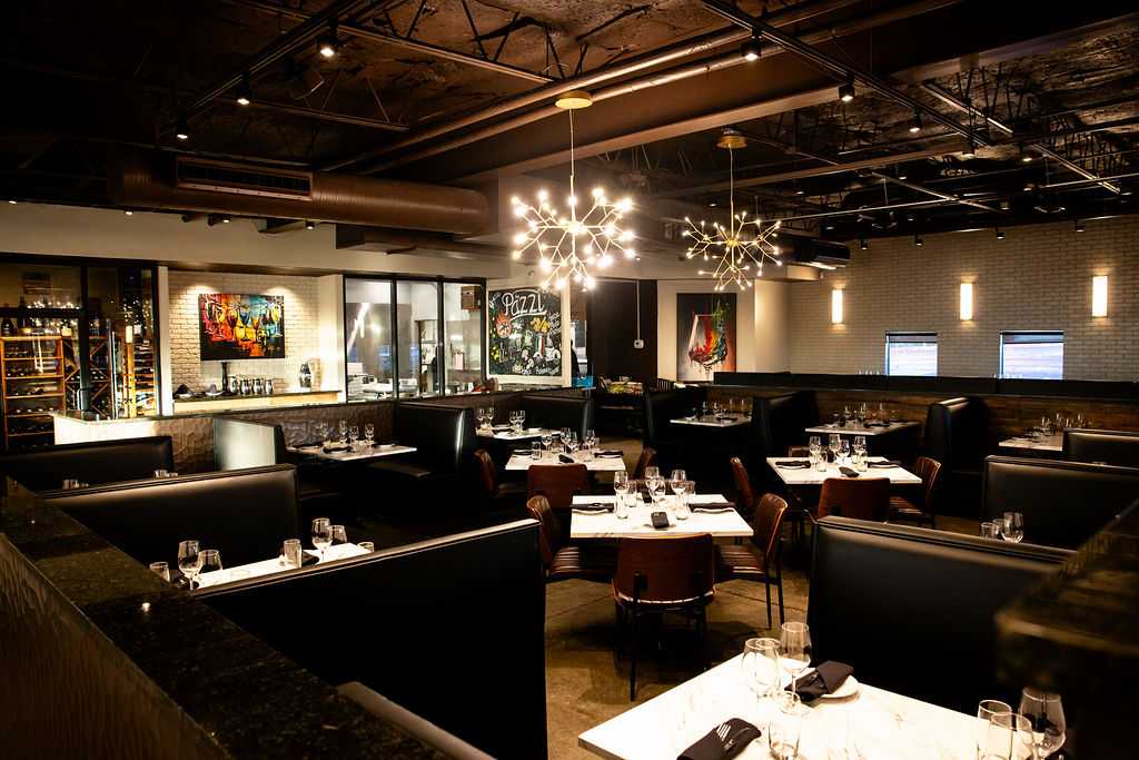 Elegant dining room at Pazzi Ristorante Italiano in Albuquerque, featuring upscale seating, ambient lighting, and a sophisticated atmosphere for fine dining, wine dinners, and special events.